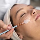high-angle-woman-getting-massaged-spa