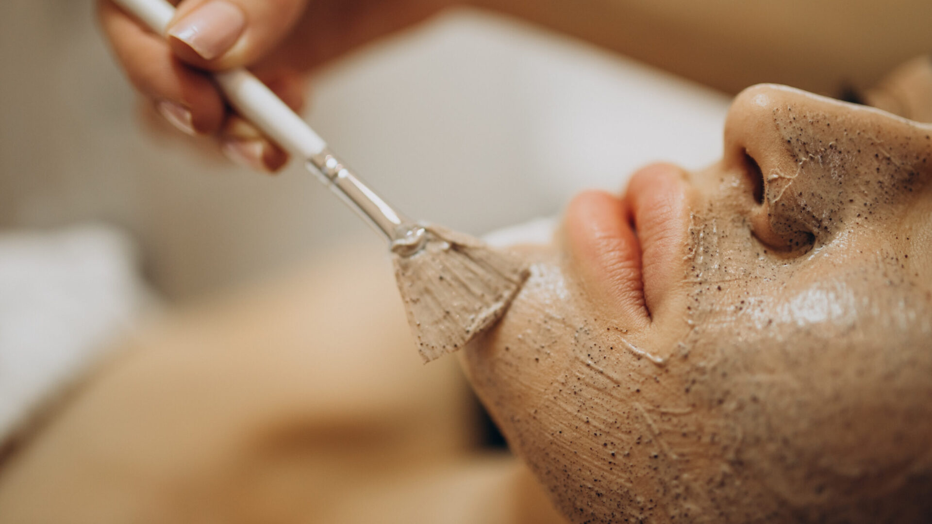 Woman visiting cosmetologist and making rejuvenation procedures